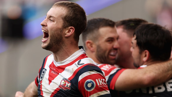 Sam Walker and the Roosters celebrate a try.