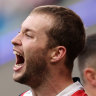 Sam Walker and the Roosters celebrate a try.