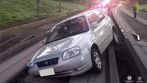 Elderly driver wedges car on bus track