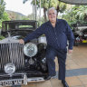 Clive Palmer at the Palmer Coolum Resort with a car from his vast car collection.