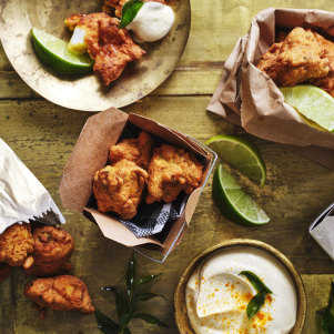 Fish pakoras with turmeric yoghurt and lime.