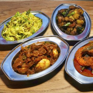 Dishes of egg, cabbage, prawns with okra, and dry pork at Toddy Shop.