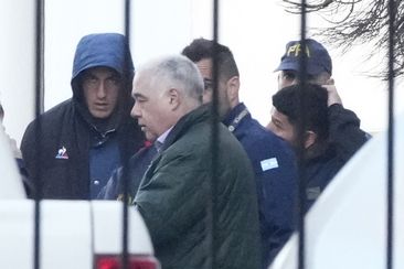 Police escort French rugby players Oscar Jegou and Hugo Auradou in Buenos Aires.