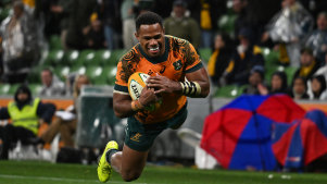 MELBOURNE, AUSTRALIA - JULY 13: Filipo Daugunu of the Wallabies scores a try during the International Test Match between Australia Wallabies and Wales at AAMI Park on July 13, 2024 in Melbourne, Australia. (Photo by Daniel Pockett/Getty Images)