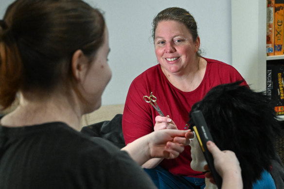 Heidi Ryan supervises her daughter’s wig styling ahead of a cosplay convention.