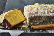 This lemon cake is briefly soaked in syrup and rolled in vanilla-lemon sugar to create a crust.