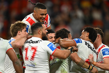 Dragons players celebrate a Jaydn Su&#x27;A try during their round 19 NRL match against the Brisbane Broncos.