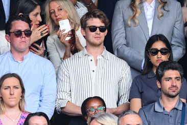 LONDON, ENGLAND - JULY 13: Joe Alwyn court-side of Centre Court on day thirteen of the Wimbledon Tennis Championships at the All England Lawn Tennis and Croquet Club on July 13, 2024 in London, England. (Photo by Karwai Tang/WireImage)