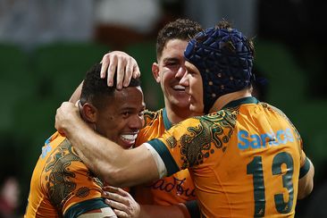 Filipo Daugunu of the Wallabies celebrates with after scoring a try.