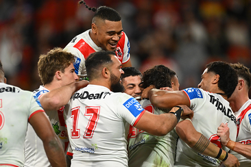 Dragons players celebrate a Jaydn Su&#x27;A try during their round 19 NRL match against the Brisbane Broncos.