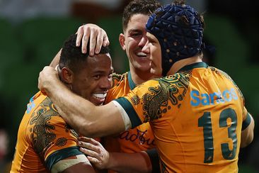 Filipo Daugunu of the Wallabies celebrates with after scoring a try.