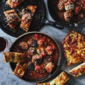 Serve these oven-baked meatballs with cheesy garlic bread.