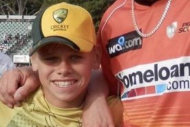 A young Cooper Connolly with Perth Scorchers quick A.J. Tye.