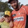 A young Cooper Connolly with Perth Scorchers quick A.J. Tye.