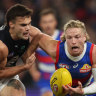 Cody Weightman of the Bulldogs runs with the footy.