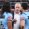 Blues coach Michael Maguire talks to Jarome Luai and Mitchell Moses at half-time of Origin II after rushing to the sideline.