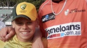 A young Cooper Connolly with Perth Scorchers quick A.J. Tye.