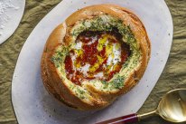 Canned tomato soup is elevated to new heights in this version, served inside a garlic-buttered cob loaf.