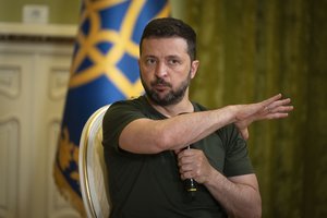 Ukrainian President Volodymyr Zelenskyy gestures during a press conference in Kyiv, Ukraine, Monday, July 15, 2024.