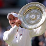 Barbora Krejcikova of Czechia lifts the trophy following victory against Jasmine Paolini of Italy.