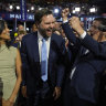 Republican vice presidential candidate Senator JD Vance and his wife Usha Chilukuri Vance arrive on the floor during the first day of the 2024 Republican National Convention.