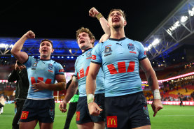 Zac Lomax celebrates with the Blues after winning State of Origin.