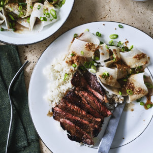 Marinated minute steaks with sesame daikon salad and steamed rice.