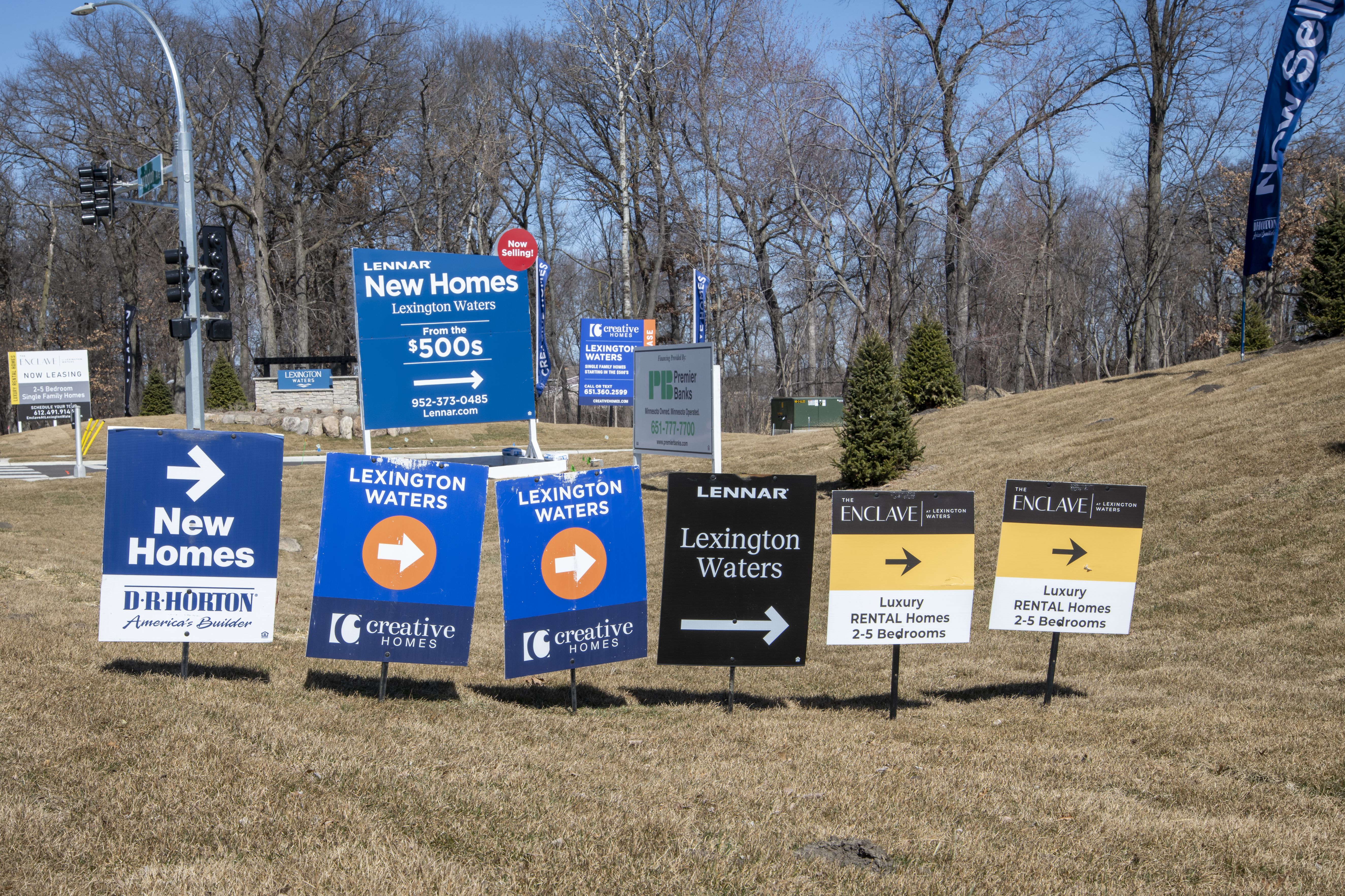 A group of signs advertising the new half million dollar homes in Blaine, Minnesota.