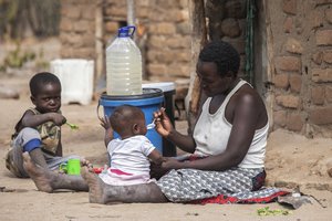 Children eat porridge prepared at a feeding center in Mudzi, Zimbabwe, on July 2, 2024. In Zimbabwe, an El Nino-induced drought is affecting millions of people, and children are most at risk.