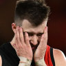 Zach Merrett of the Bombers looks dejected.