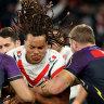 Roosters winger Dominic Young braces for contact as the Storm make a two-man tackle.