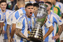 Enzo Fernandez celebrates with the trophy after the Copa America final.
