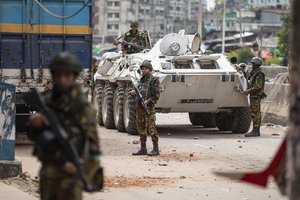 Bangladeshi military force soldiers patrol a street during a nationwide curfew in Dhaka, Bangladesh, Saturday, July 20, 2024.