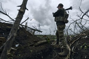 A Ukrainian soldier fires an RPG toward Russian positions at the frontline near Avdiivka, an eastern city where fierce battles against Russian forces have been taking place, in the Donetsk region, Ukraine, Friday, April 28, 2023.