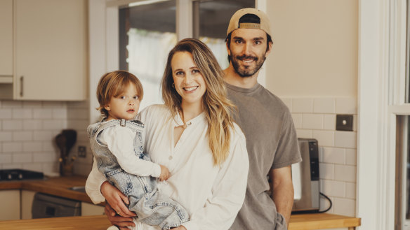 Adam and Olivia Jeffrey, with son Xavier, sold their apartment and an investment apartment to buy a house to live in.