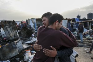 Palestinians react next to the destruction after an Israeli strike where displaced people were staying in Rafah, Gaza Strip, Monday, May 27, 2024. Palestinian health workers said Israeli airstrikes killed at least 35 people in the area. Israel's army confirmed Sunday's strike and said it hit a Hamas installation and killed two senior Hamas militants. (AP Photo/Jehad Alshrafi)