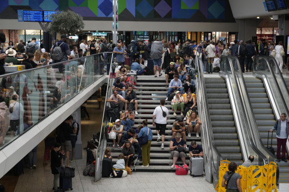 Travellers face delays at the Gare de Montparnasse station in Paris.