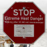 A stop sign warns tourists of extreme heat at Badwater Basin.