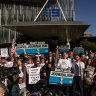 Striking workers outside Nine’s offices in Melbourne on Friday.