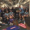 Rugby league nice guy Jake Trbojevic swings a baseball bat in front of his Blues brothers in a Suncorp Stadium dressing room.