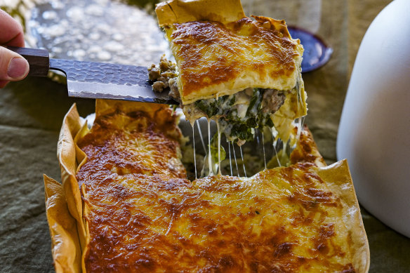 Three-cheese lasagne with overhanging edges for extra crispy bits.