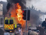 A police van buns as and unruly crowd clashed with police.