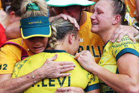 Teagan and Maddison Levi are comforted following the women’s sevens side’s loss in the bronze-medal match.