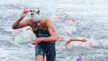 Triathlete Sophie Linn makes it out of the Seine in one piece.