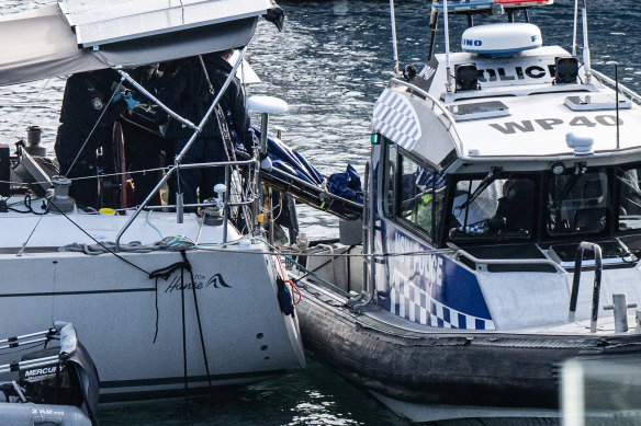 Water police remove two bodies from the yacht “Taloha” near Folly Point at Cammeray.