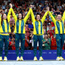 Gold medalists Mollie O’Callaghan, Lani Pallister, Brianna Throssell and Ariarne Titmus of Australia celebrate on the podium during the swimming medal ceremony.