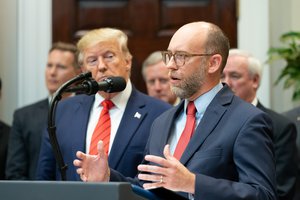 President Donald J. Trump listens to the Office of Management and Budget Acting Director Russ Vought delivers remarks prior to President Trump signing Executive Orders on Transparency in Federal Guidance and Enforcement Wednesday, Oct. 9, 2019, in the Roosevelt Room of the White House