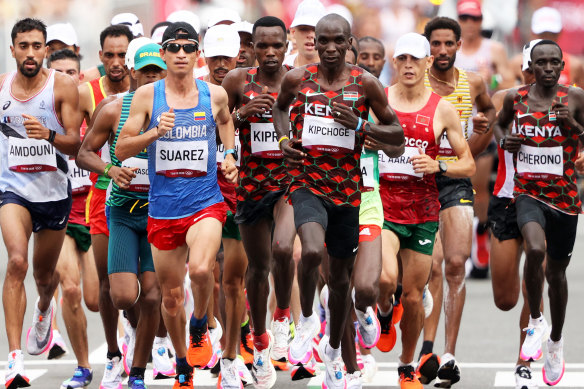 Eliud Kipchoge (centre) competes in the men’s marathon at the Tokyo 2020 Olympic Games. Kipchoge won the race with a time of