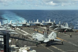 File - In this photograph released by the U.S. Navy, the flight deck of the Nimitz-class aircraft carrier USS Theodore Roosevelt is seen July 4, 2024, in the South China Sea. The Roosevelt is replacing the USS Dwight D. Eisenhower in the Navy's campaign against attacks by Yemen's Houthi rebels targeting shipping in the Red Sea corridor over the Israel-Hamas war in the Gaza Strip.