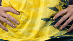 Discus competitor Taryn Gollshewsky wears the Olympic rings on her nails during the qualification at the Olympic Games.